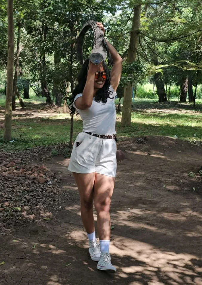 Efratah smiling on a shaded forest path in Arba Minch